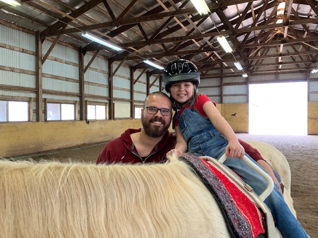 Father with his Daughter Riding Starsky the horse